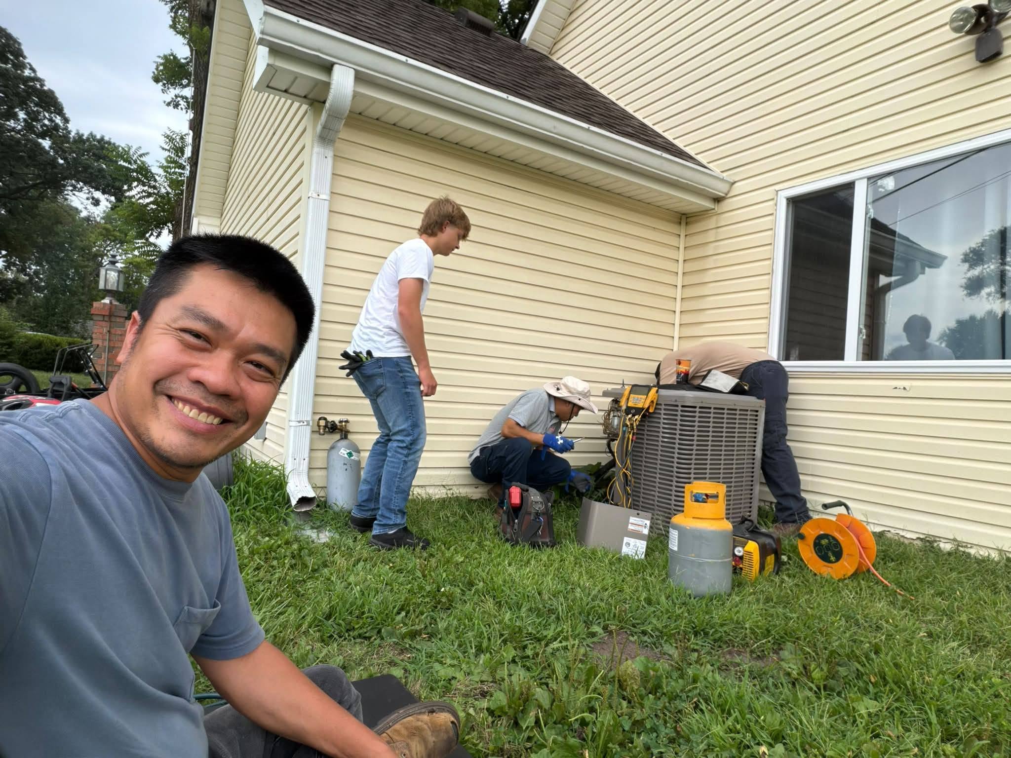 TK Heating & Cooling crew on an AC replacement job in Kansas City