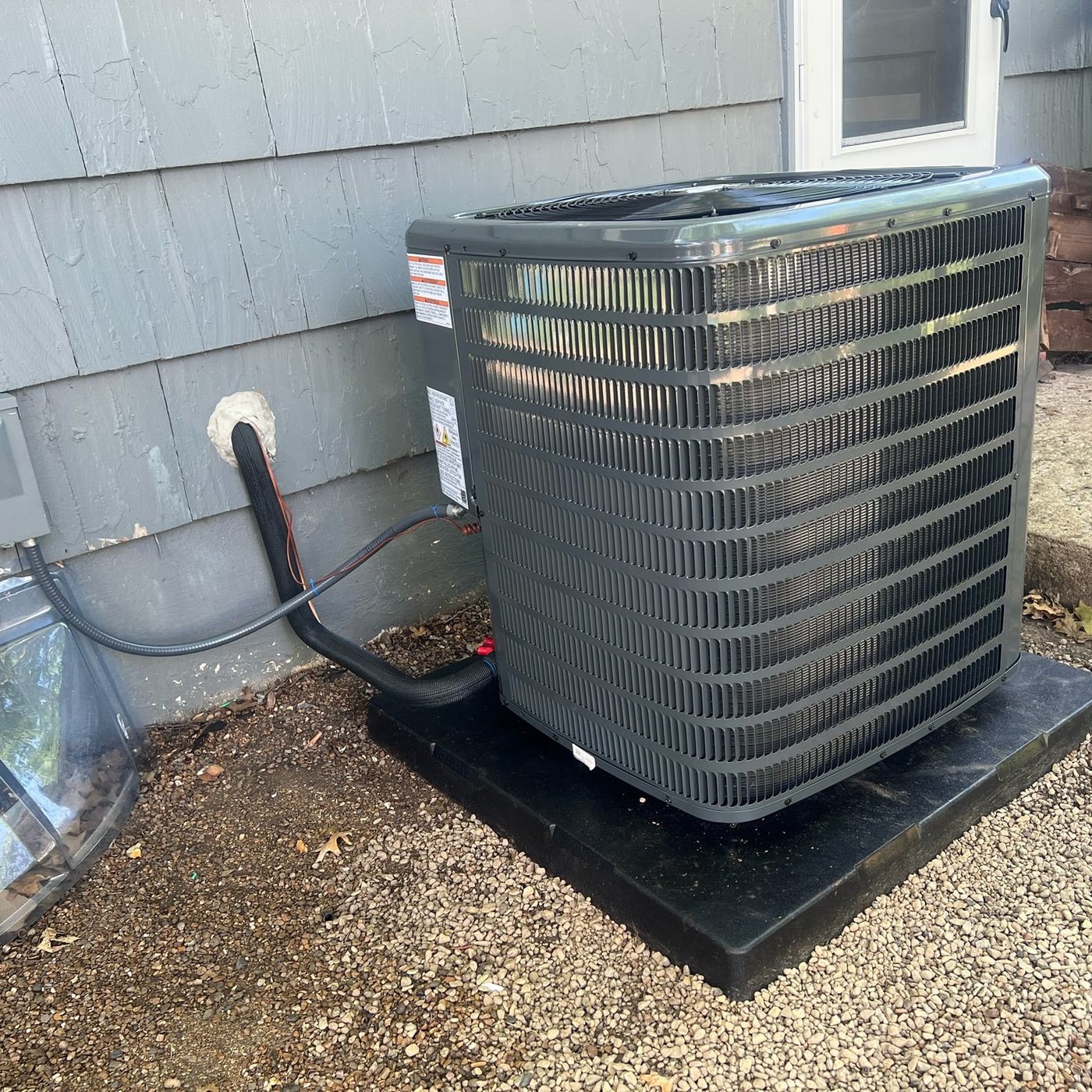 Outdoor Lennox condenser service by TK Heating & Cooling